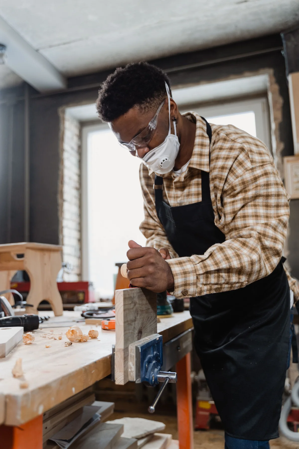 Craftsperson making furniture in a workshop